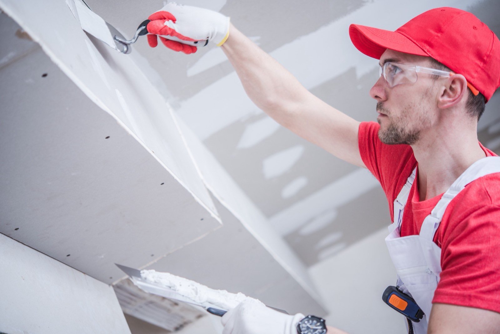 Hand applied gypsum plaster manual trowel smoothing