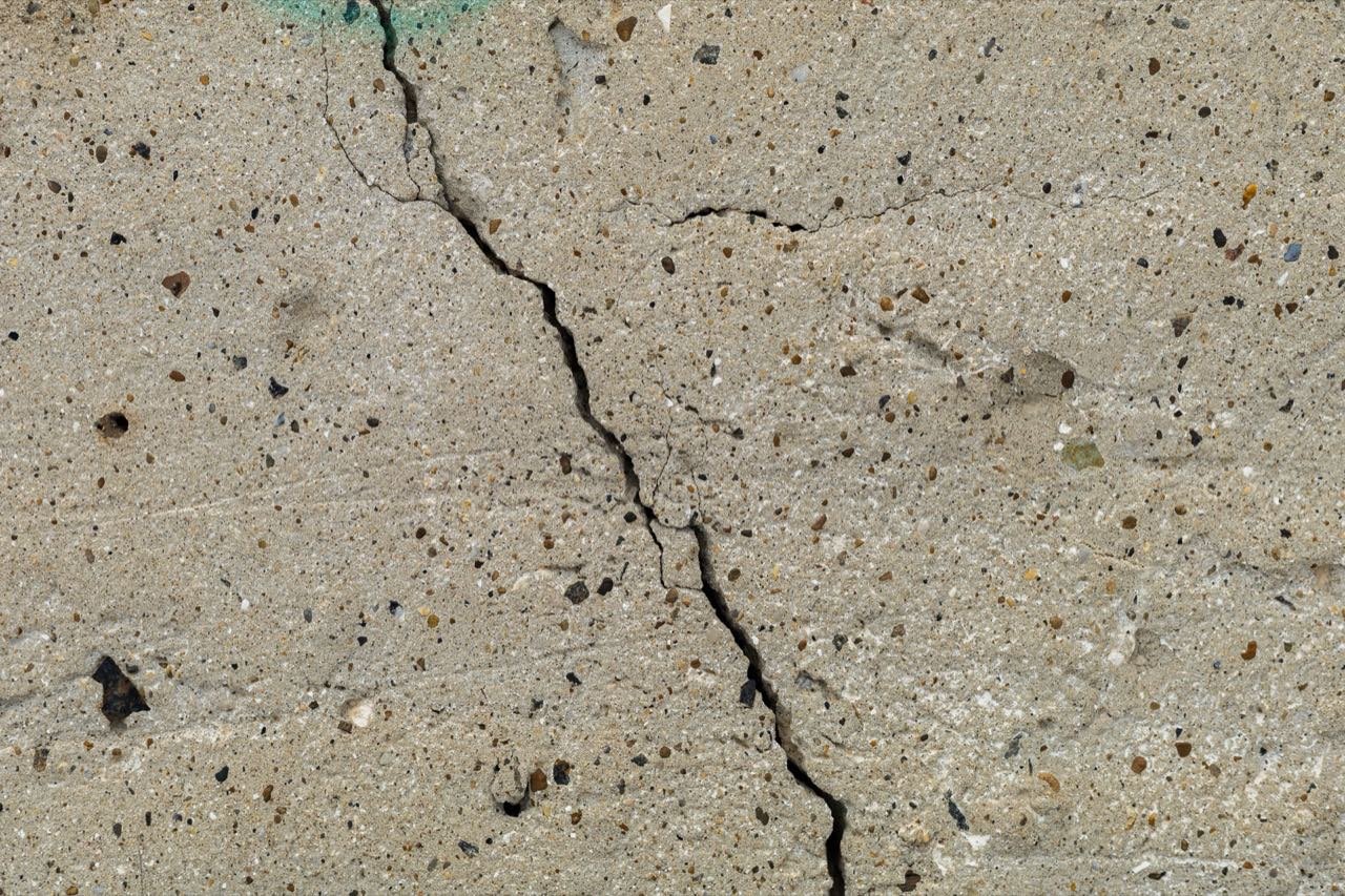 Inspection of concrete pavement cracking and joint alignment
