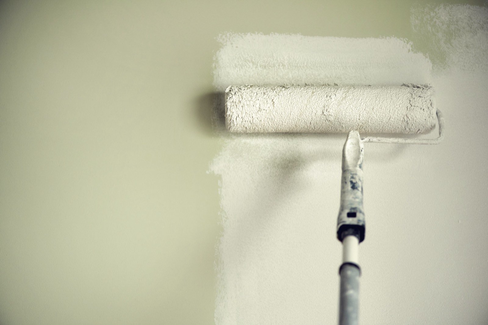 Specular gloss control and surface leveling under roller application