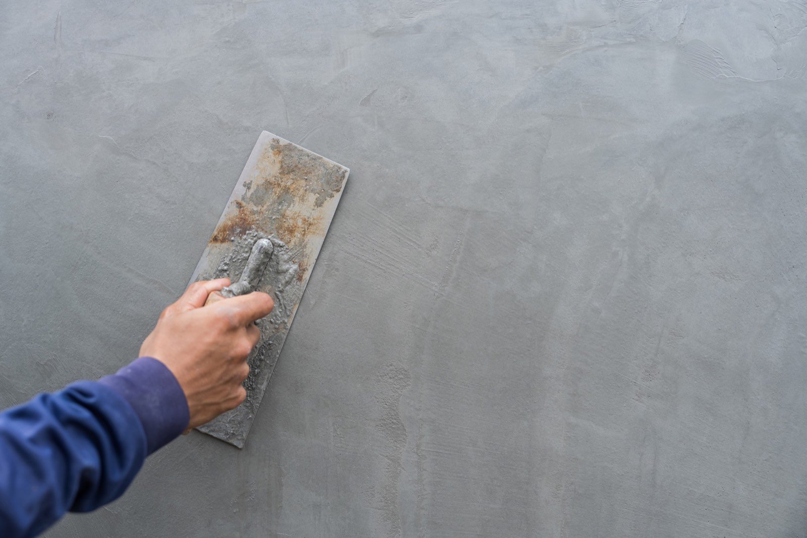 Concrete pavement construction and surface finishing