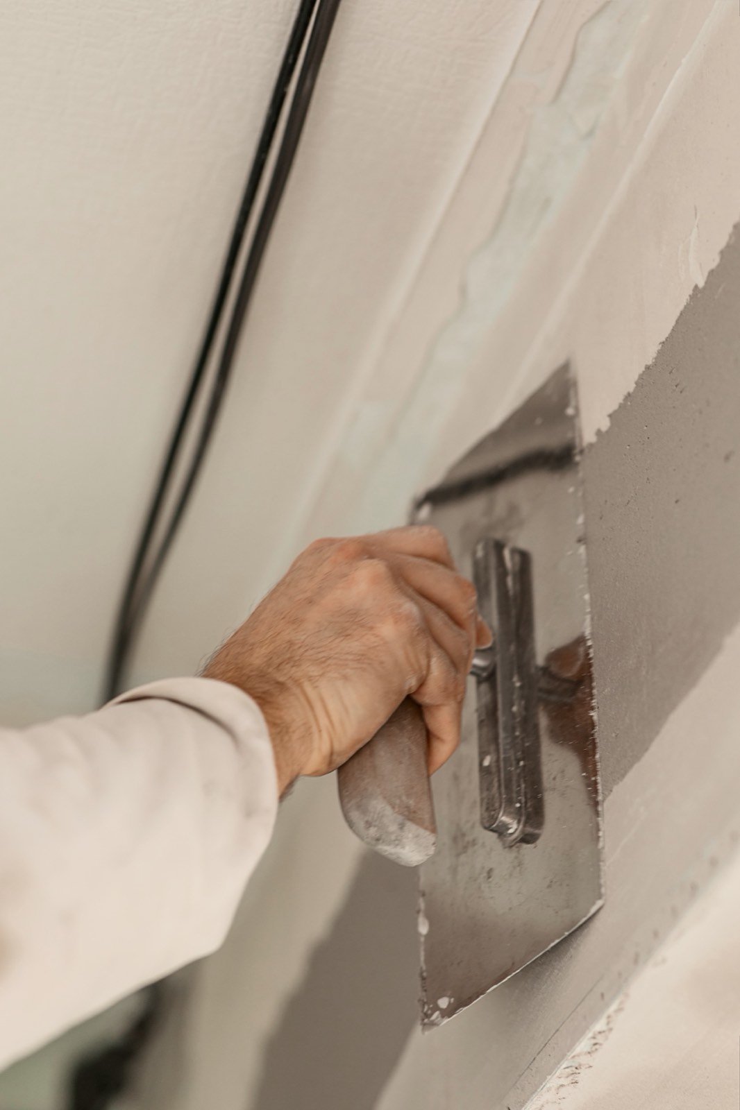 Machine spray plaster rendering on construction site
