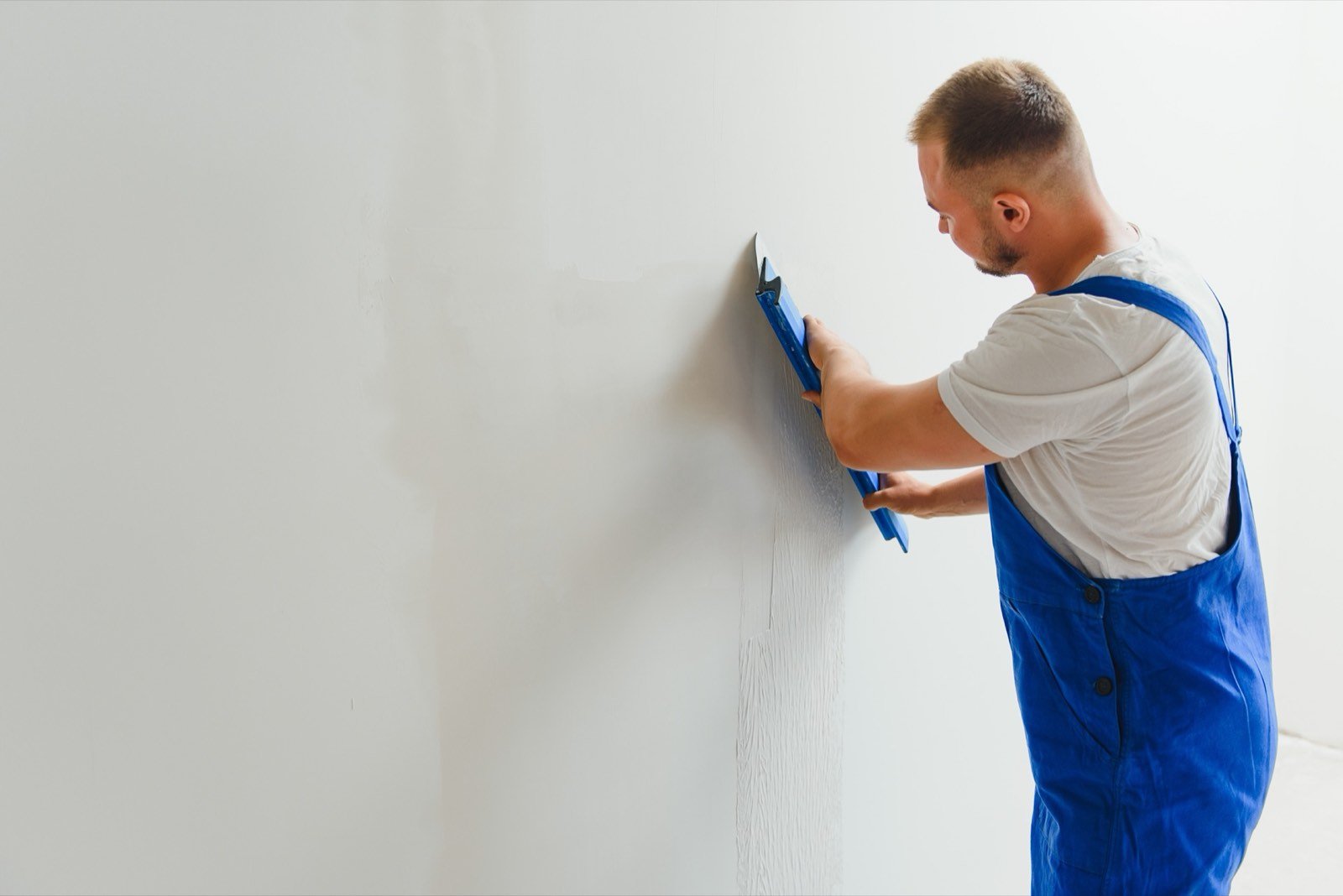 Drywall sanding and surface smoothness quality inspection