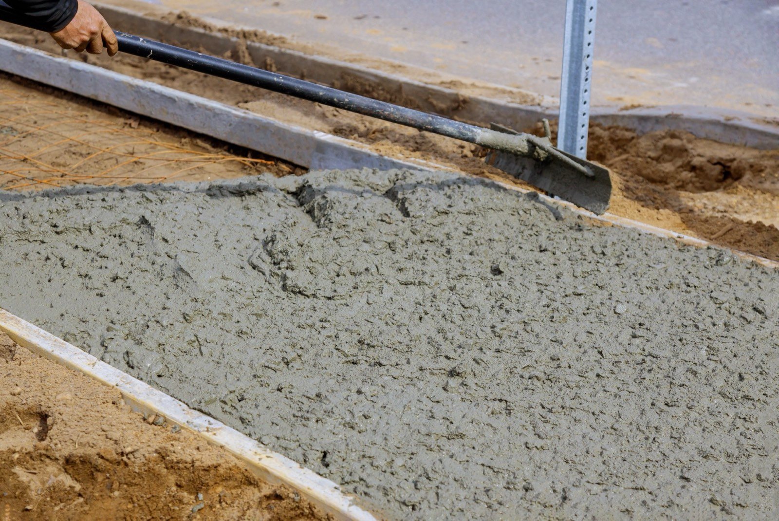 Concrete production environment for fiber mixing and placement