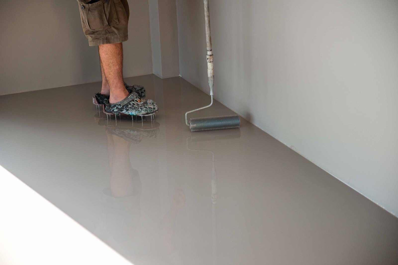 Self leveling compound smooth floor pour showing complete surface healing